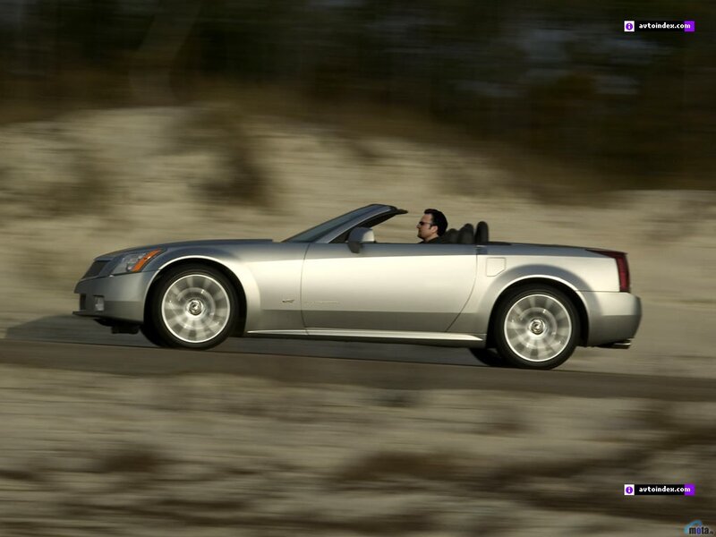 silver convertible driving fast