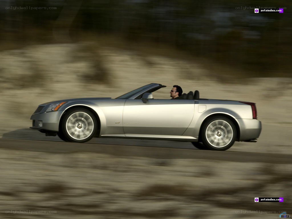 silver convertible driving fast
