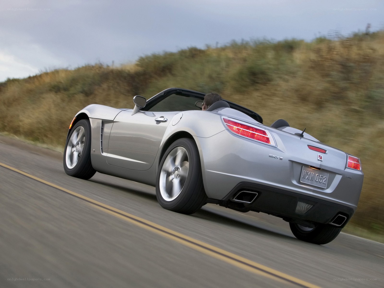 silver convertible driving on road