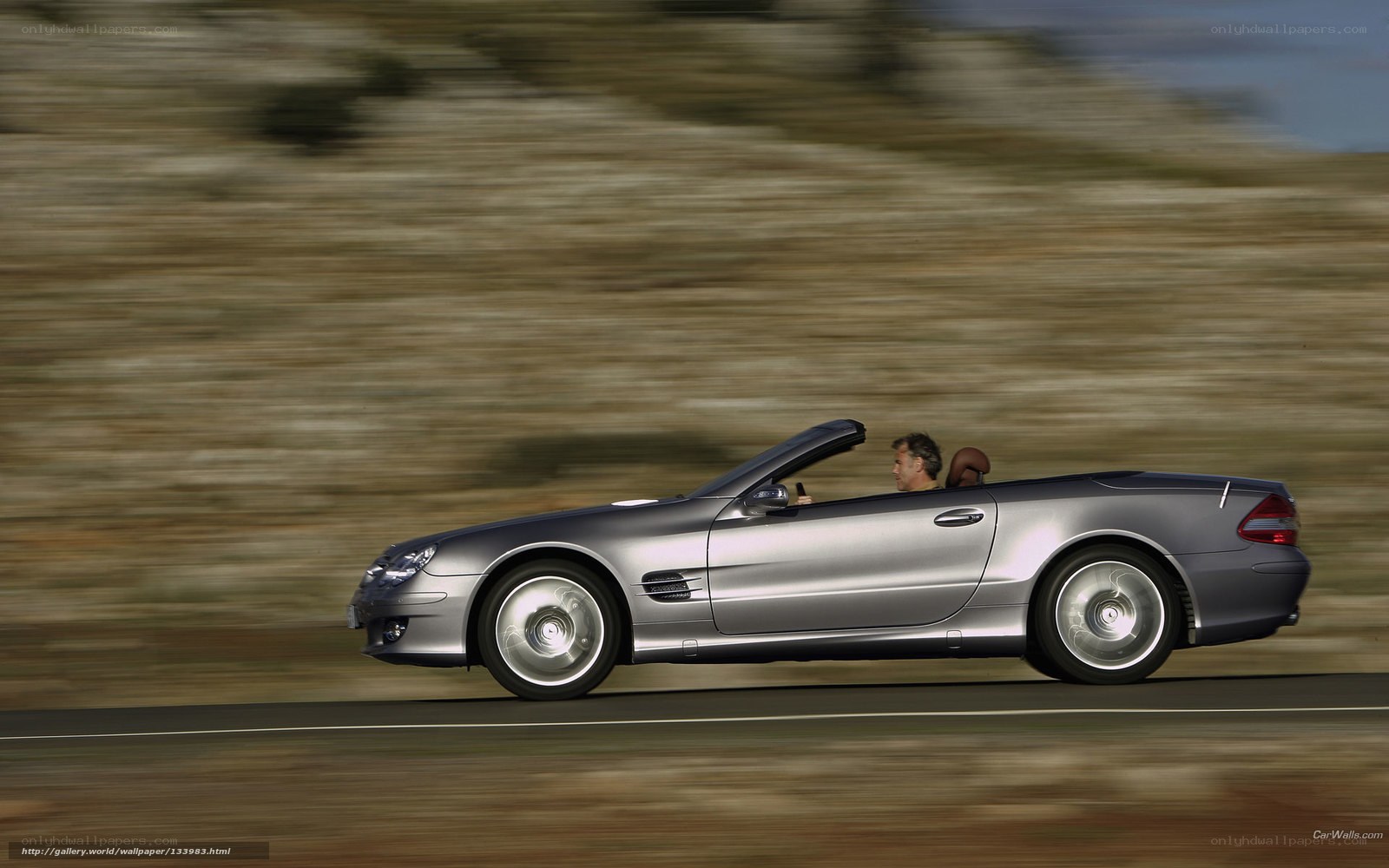 silver convertible driving on road