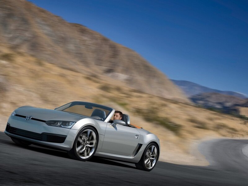 Silver convertible driving on road