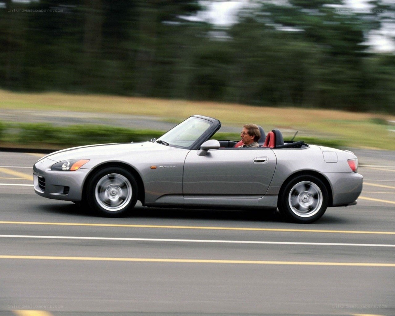 silver convertible driving on road