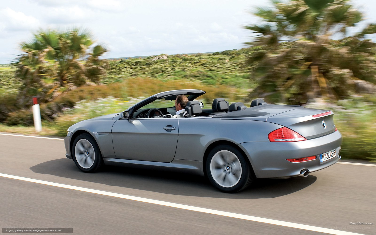 silver convertible driving on road