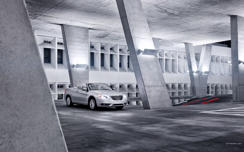 Silver convertible in concrete garage