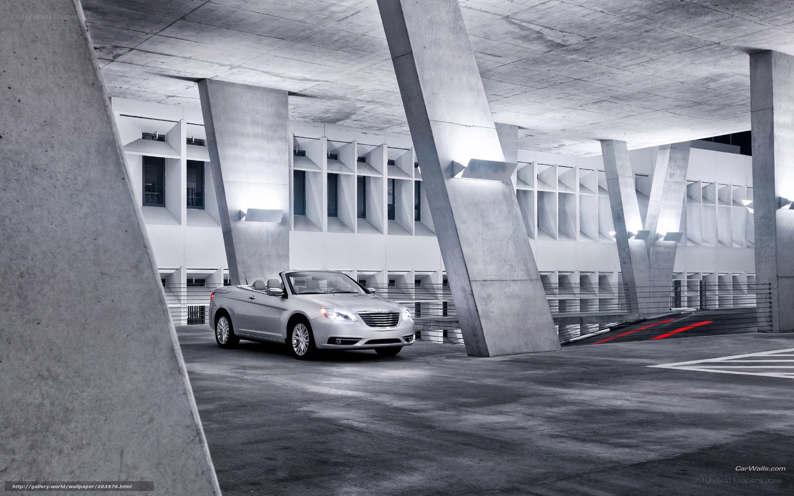 Silver convertible in concrete garage