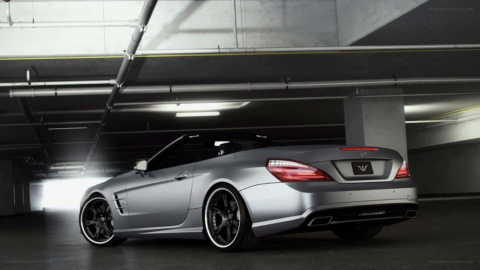 silver convertible in garage