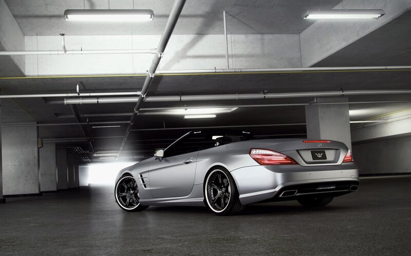 silver convertible in garage