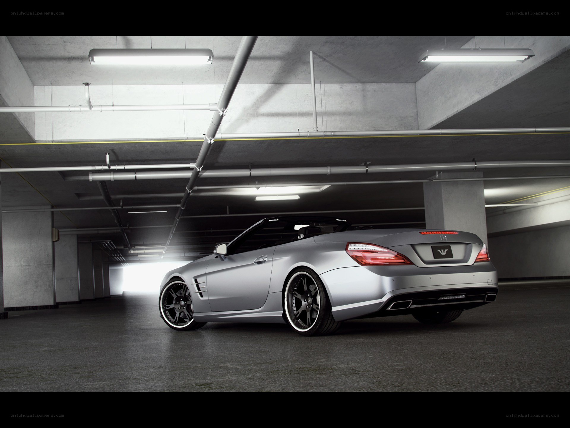 silver convertible in garage