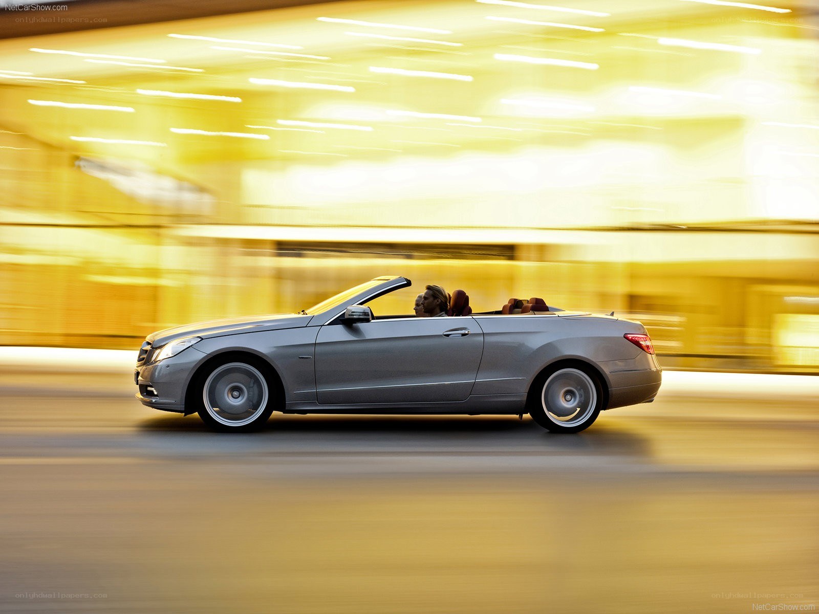 Silver convertible in motion