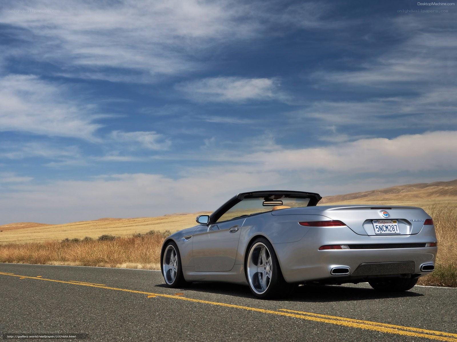 Silver convertible on a desert road