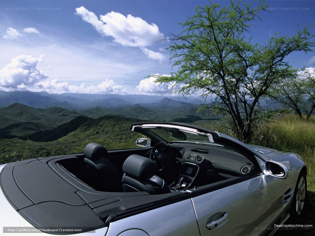 Silver convertible on a mountain vista