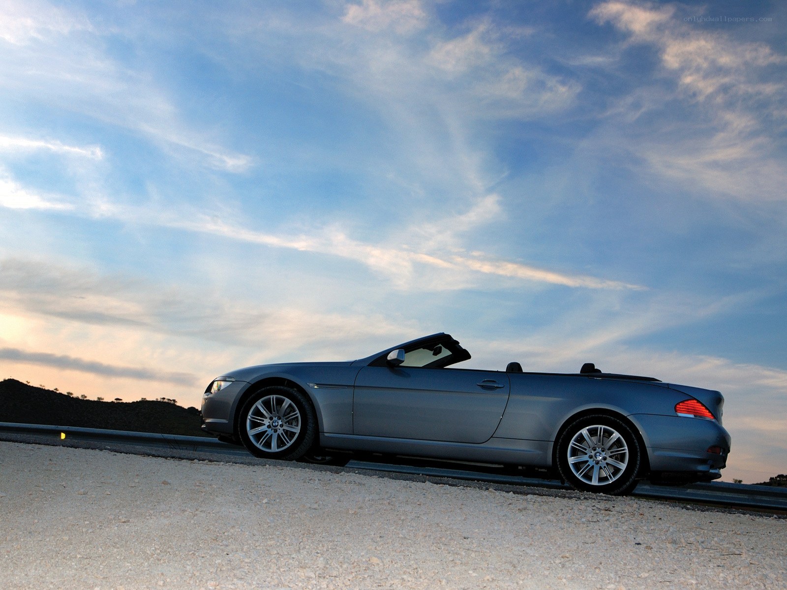 Silver convertible on a road