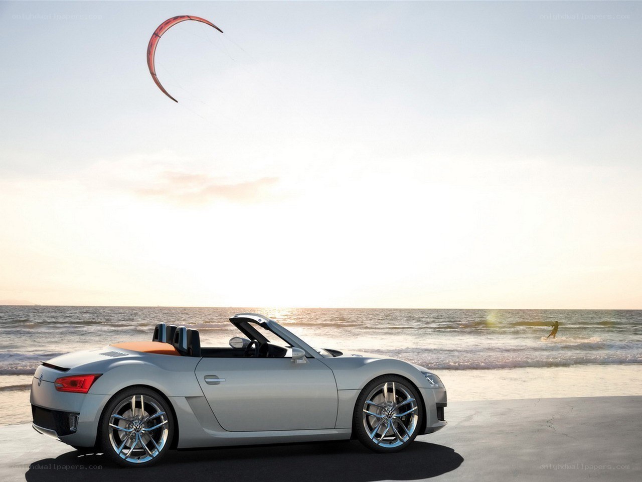 Silver convertible on beach