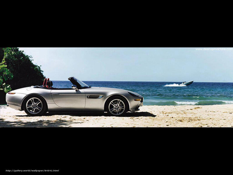 Silver convertible on beach