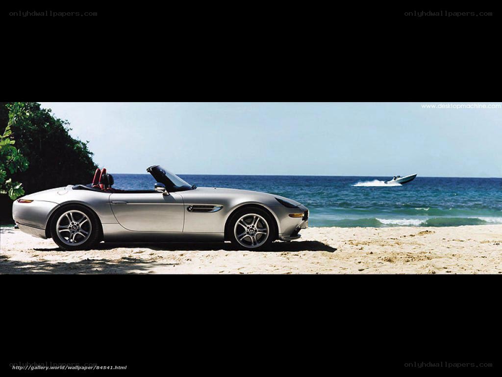 Silver convertible on beach