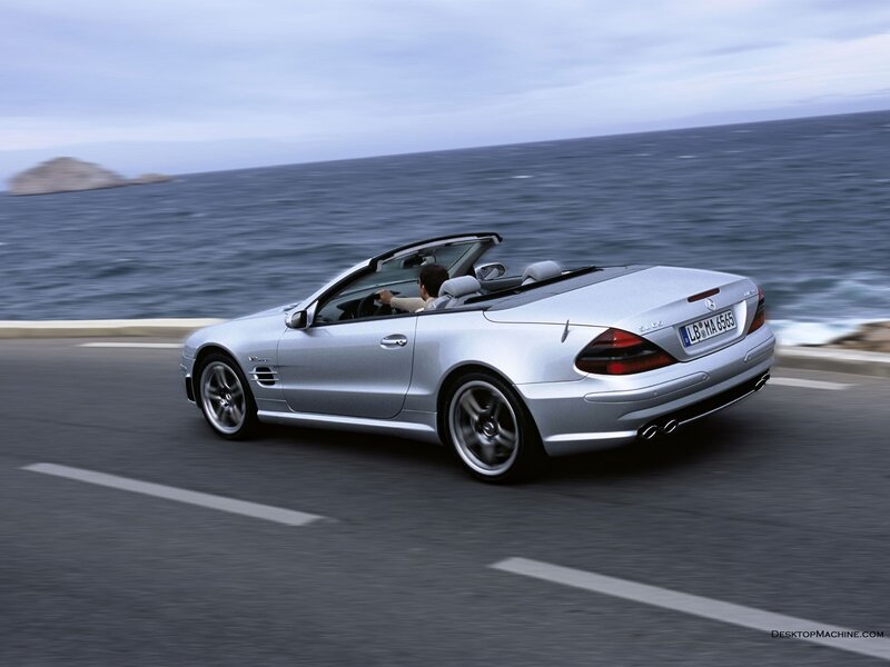 Silver convertible on coastal road