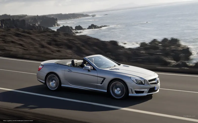 silver convertible on coastal road