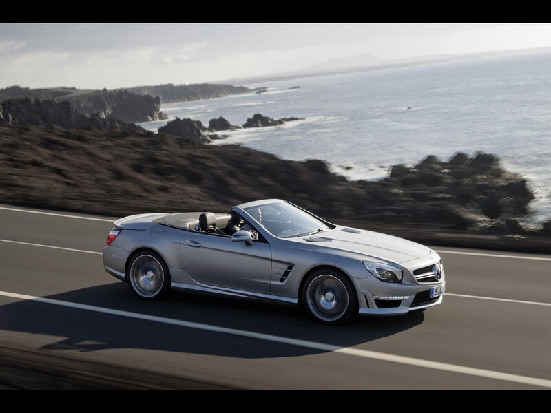 Silver convertible on coastal road