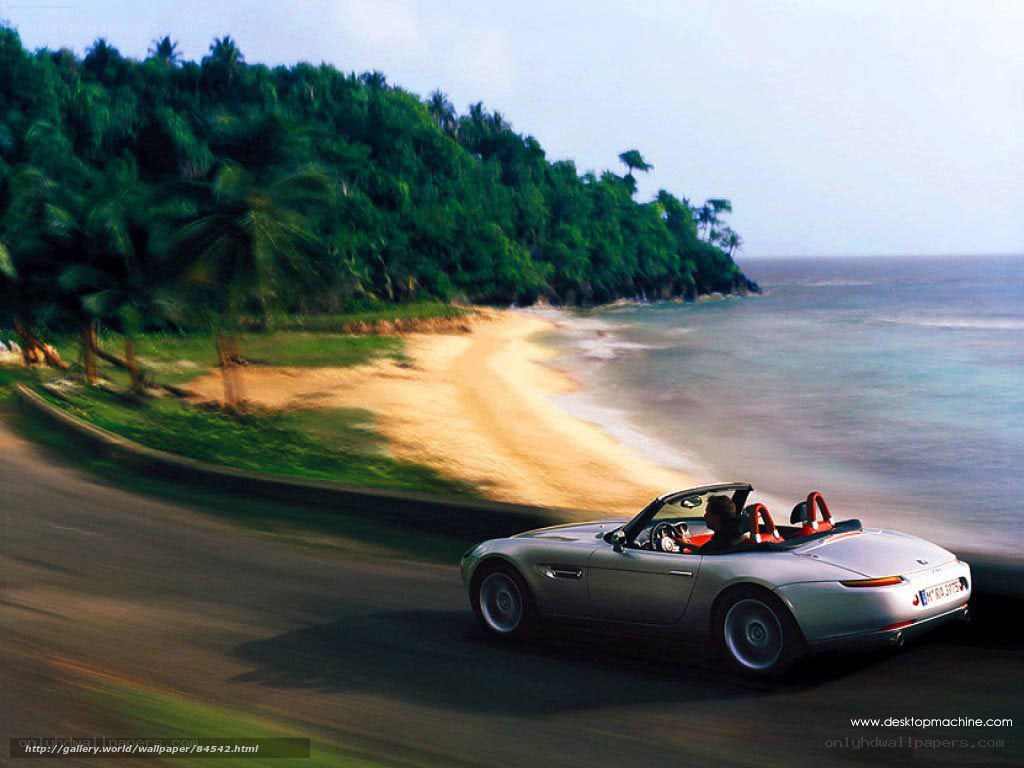 Silver convertible on coastal road