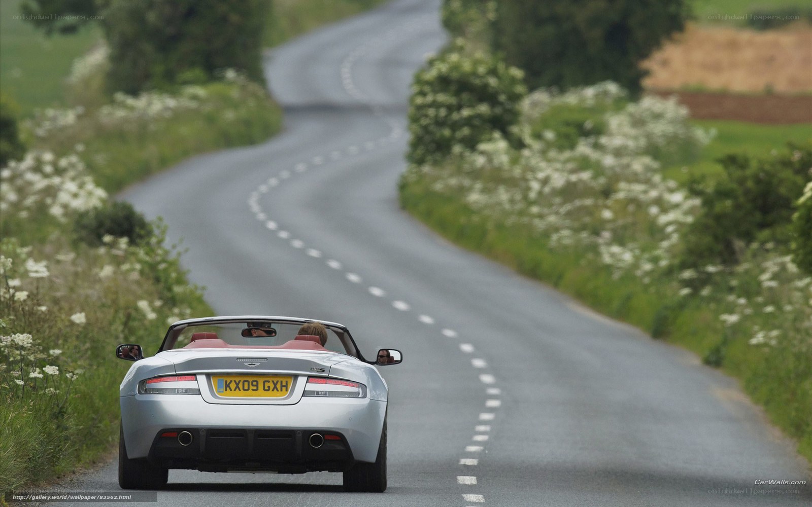 silver convertible on country road