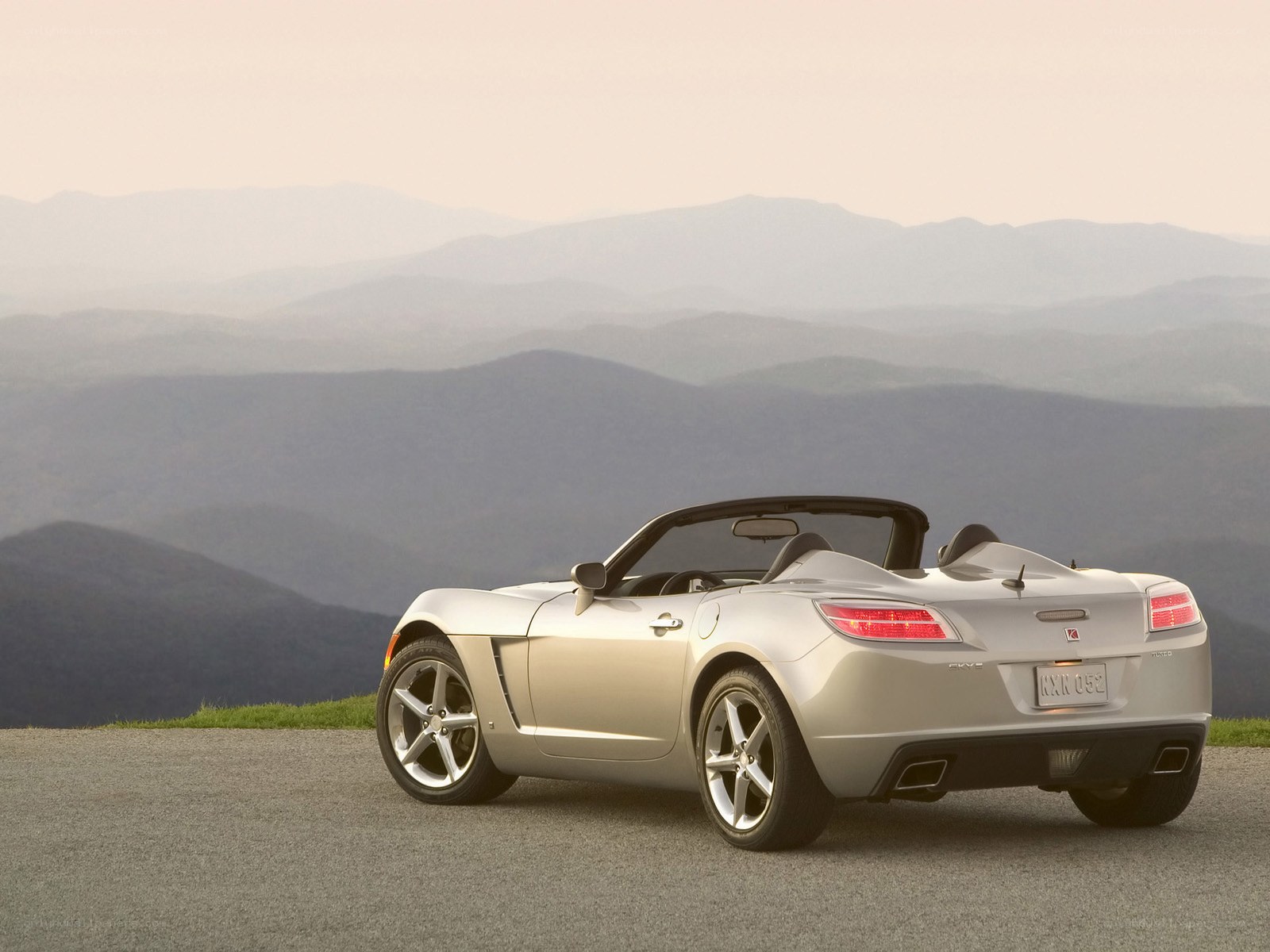 Silver convertible on mountain road