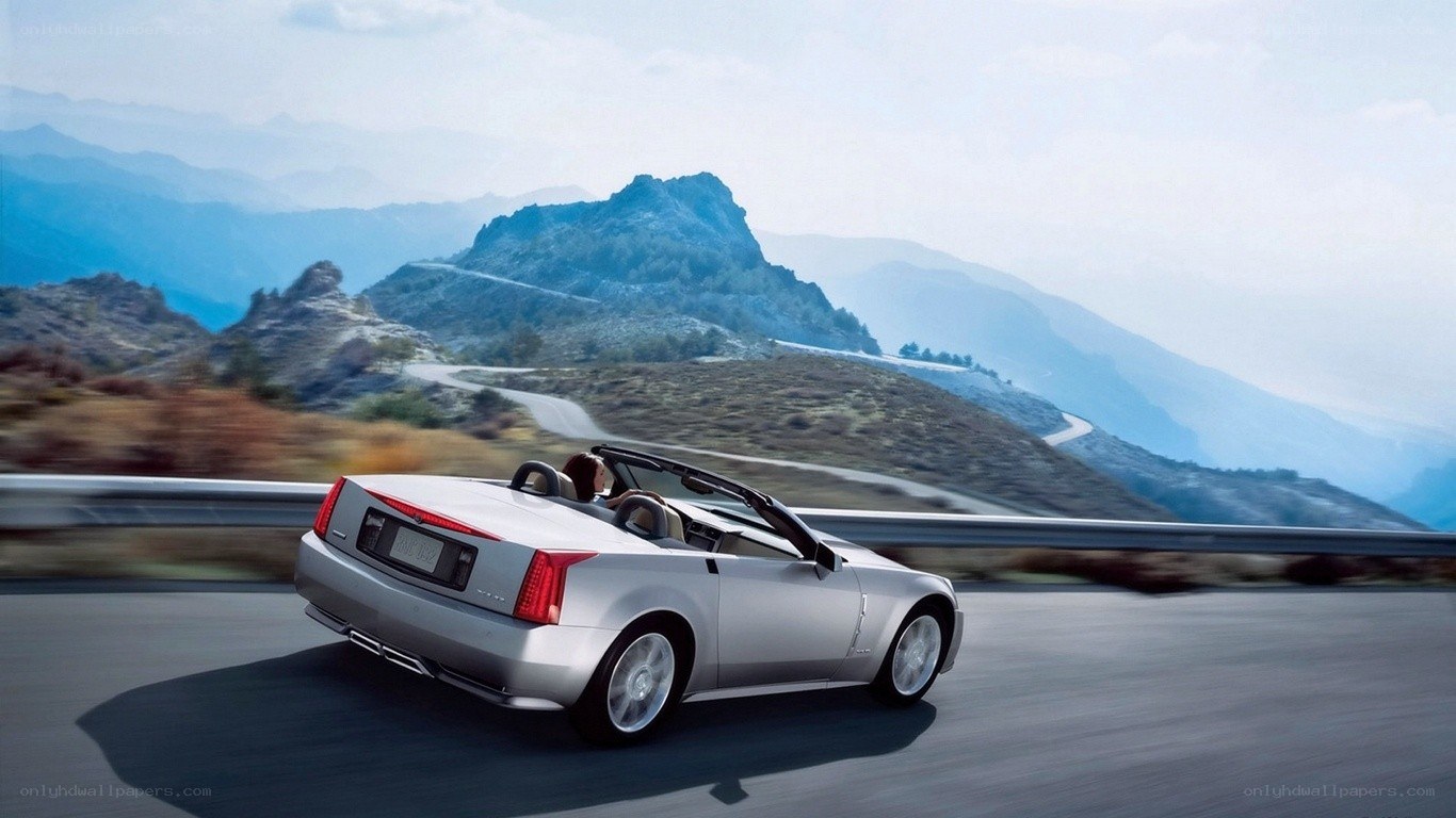 Silver convertible on mountain road