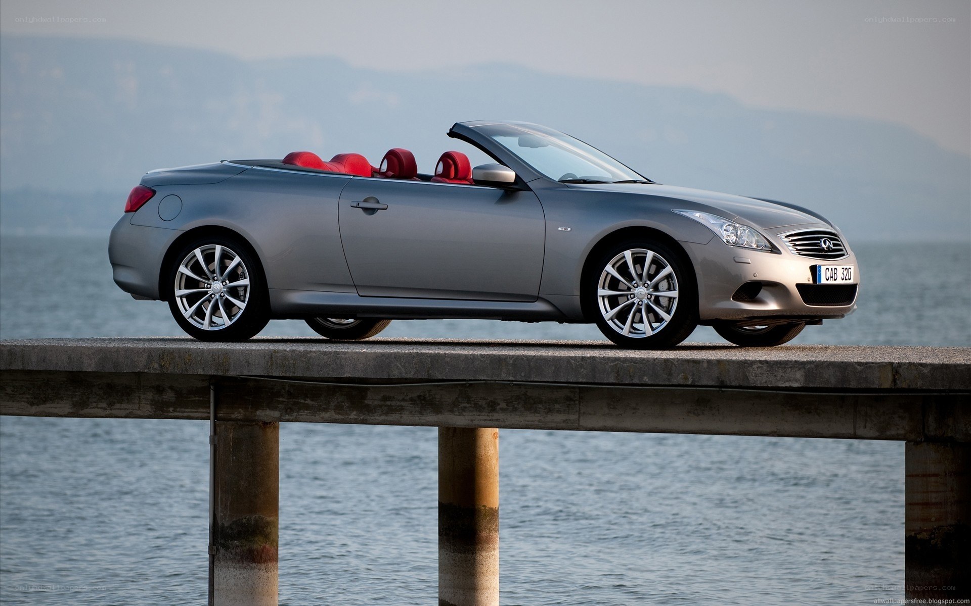 silver convertible on pier