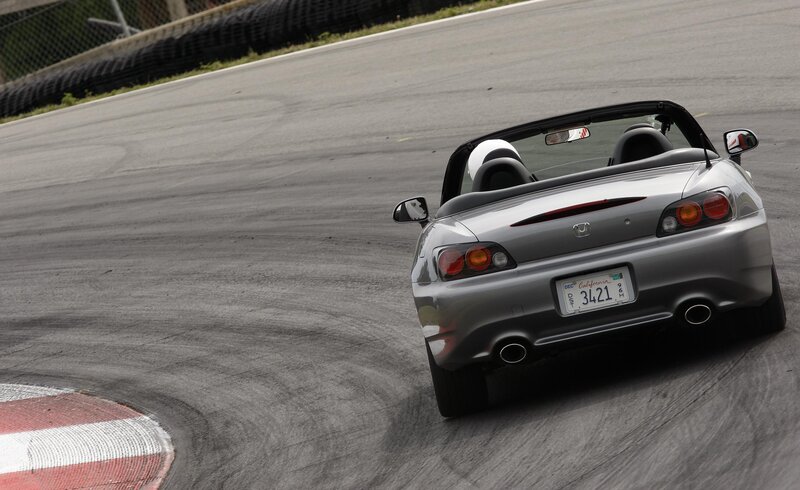 silver convertible on racetrack