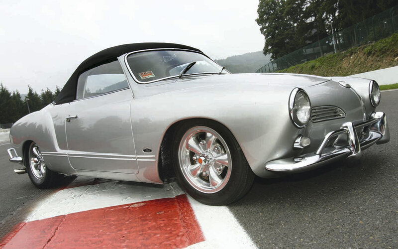 Silver convertible on racetrack