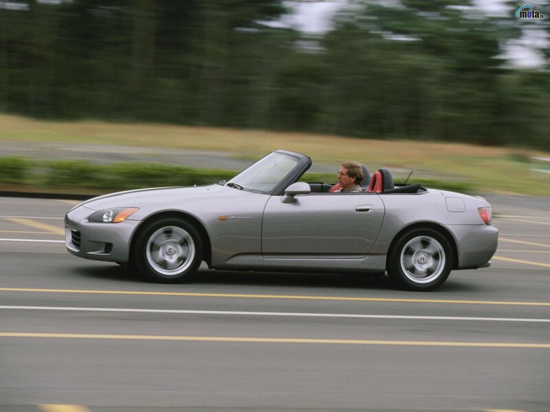 Silver convertible sports car in motion