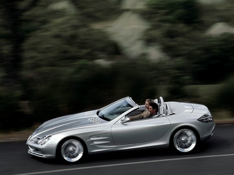 Silver convertible sports car in motion