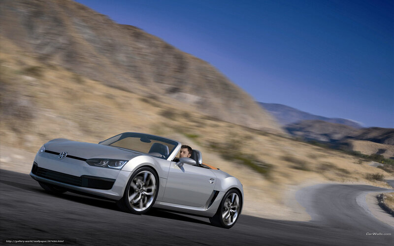 Silver convertible sports car on road