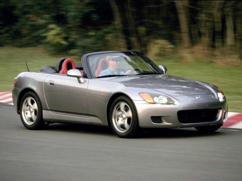 Silver convertible sports car on track