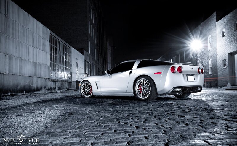 silver corvette at night