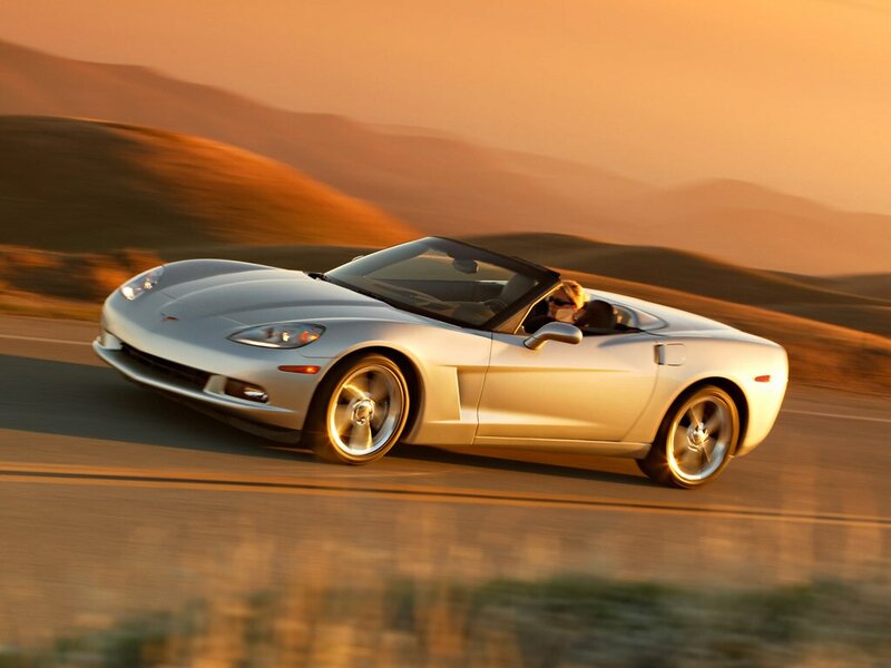 silver corvette convertible driving