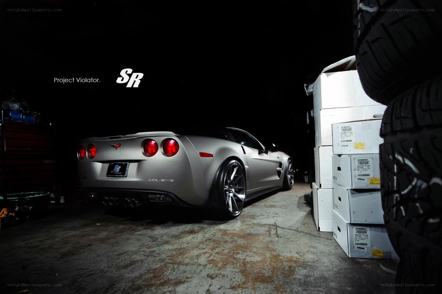 Silver Corvette in a garage