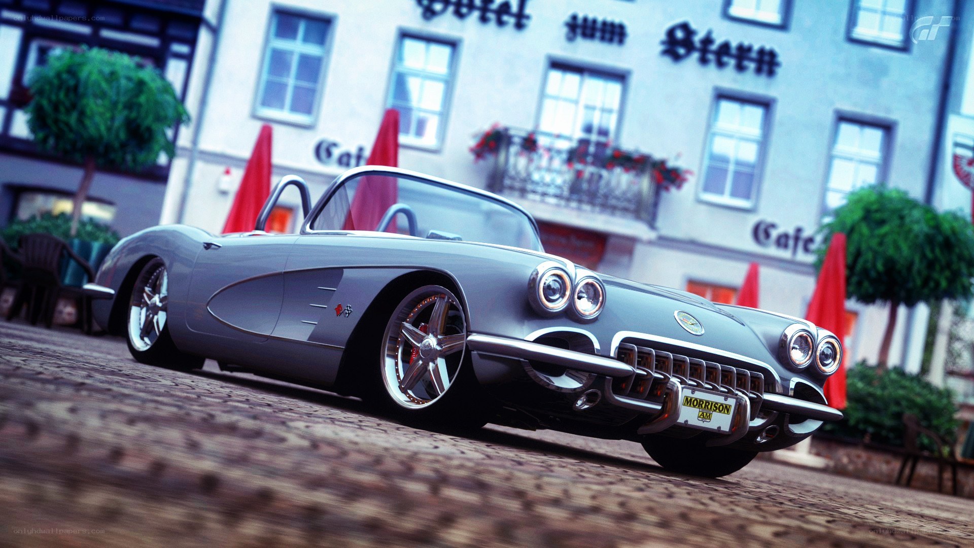 Silver Corvette on cobblestone street