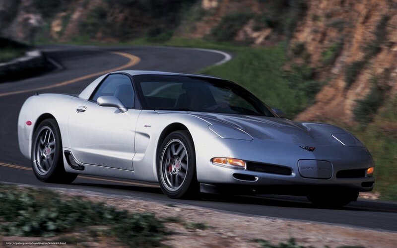 Silver Corvette on winding road