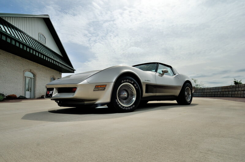 Silver Corvette parked outside