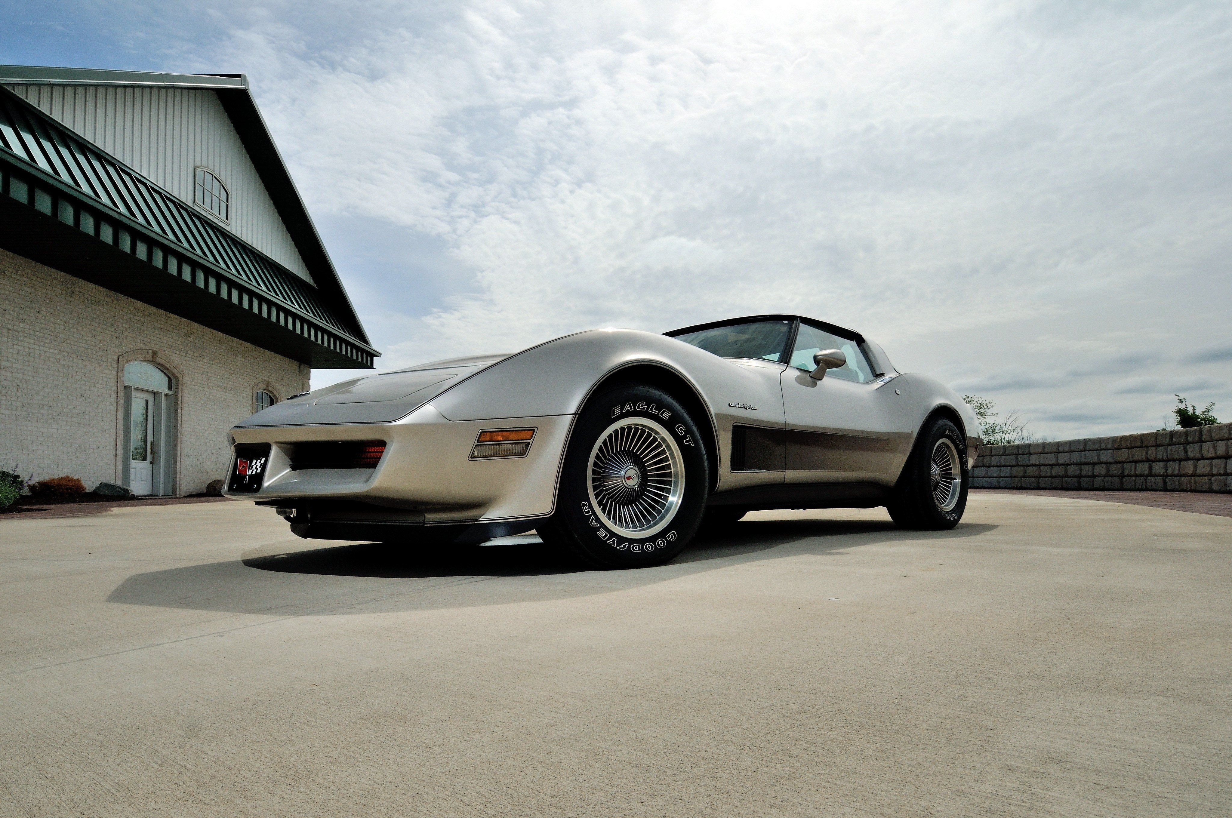 Silver Corvette parked outside