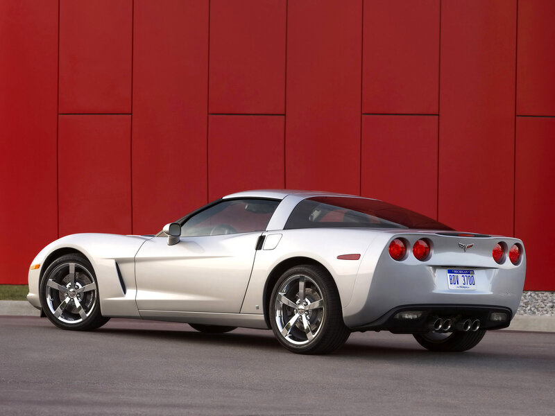 Silver Corvette Sports Car — Dramatic, Photograph, Red Wall