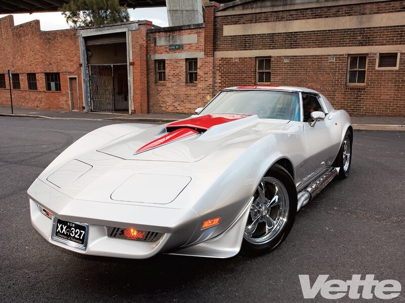 Silver Corvette with red accents