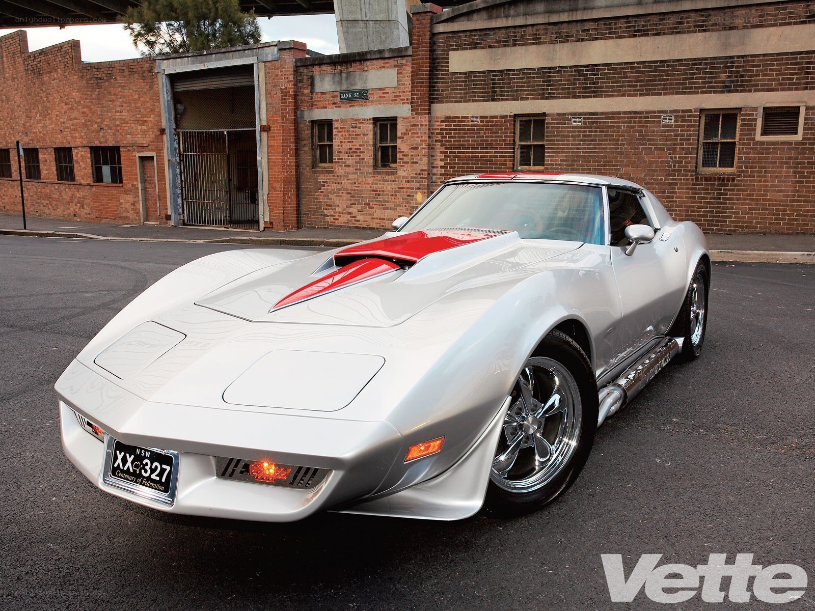 Silver Corvette with red accents