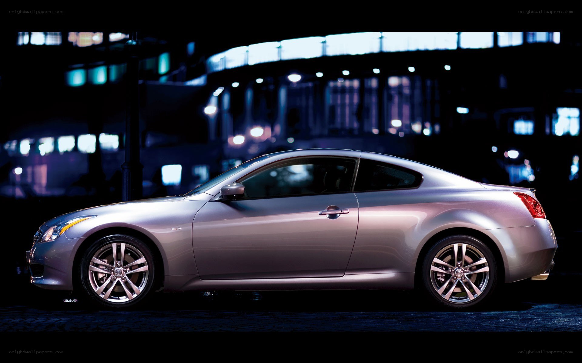 silver coupe at night