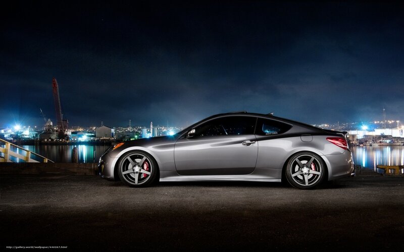 silver coupe at night by the harbor