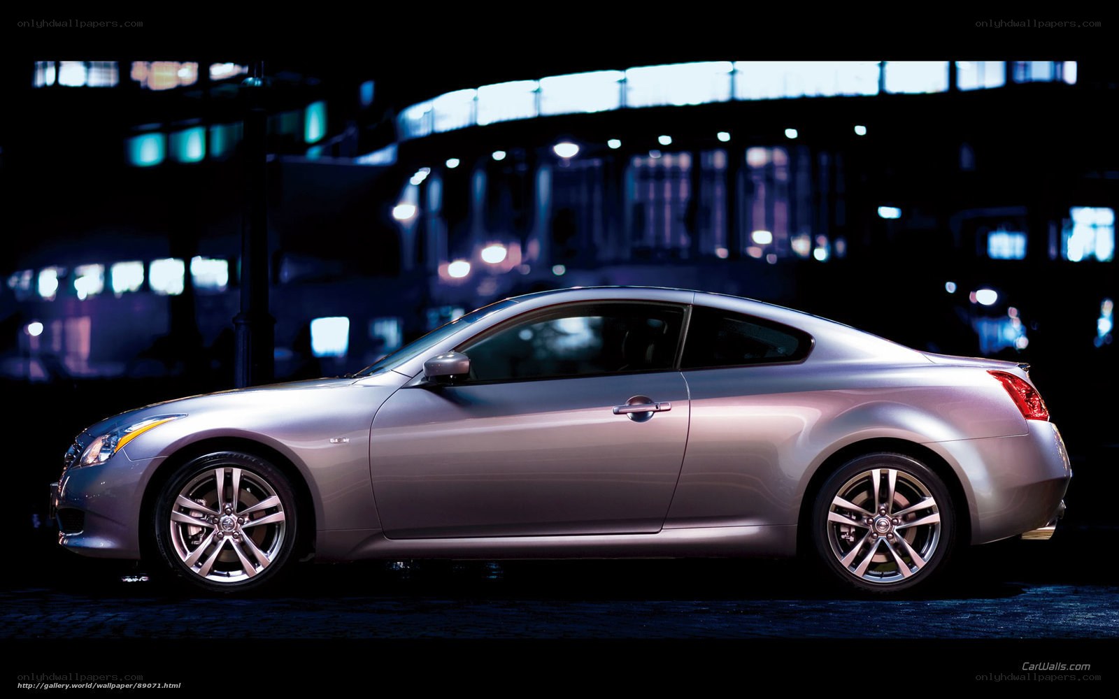 Silver coupe at night