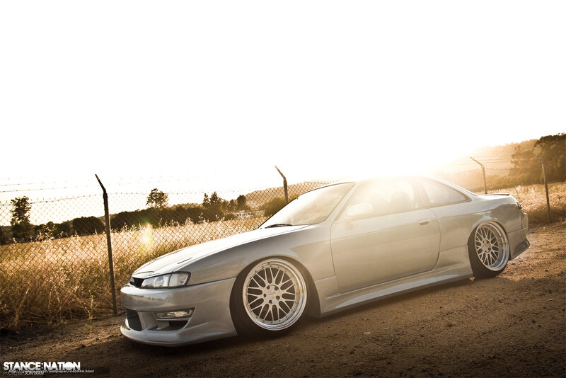 silver coupe at sunset
