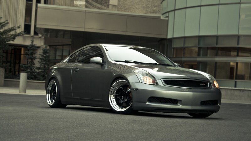 silver coupe car in city