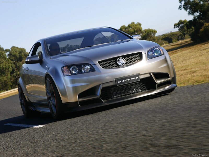 silver coupe driving on road