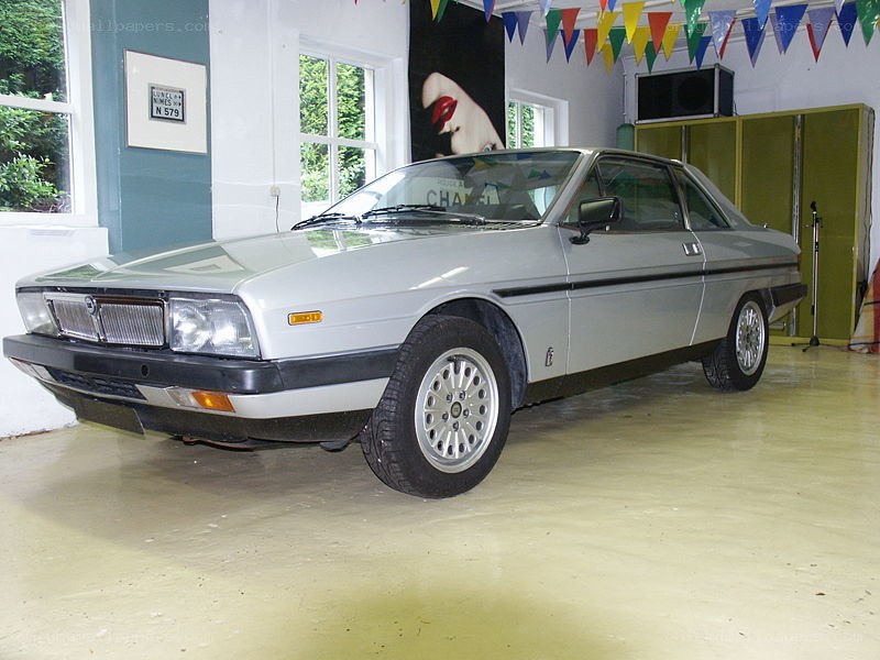 silver coupe in garage